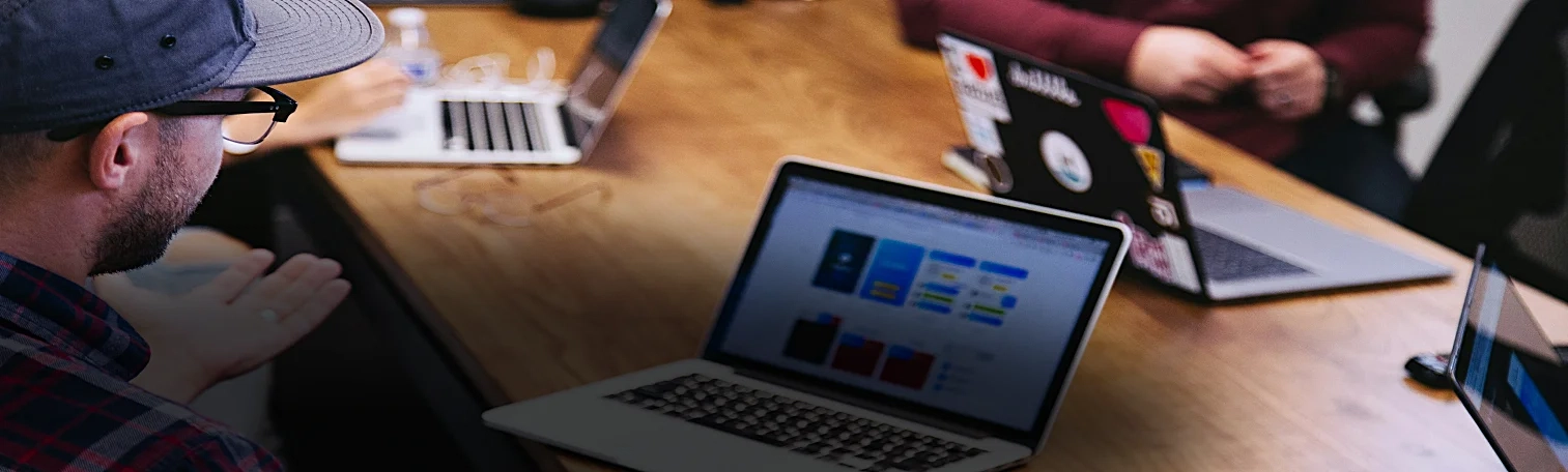 A man operating a laptop.