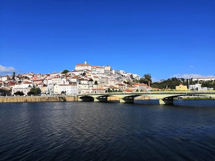 Historic University of Coimbra main building with its iconic tower and old town view, Portugal